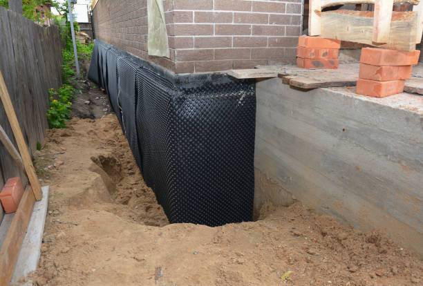 Happy homeowners after waterproofing job in Ortonville